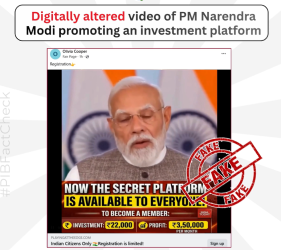 Close-up of a smartphone displaying a fake AI-generated deepfake video of Prime Minister Narendra Modi on social media.