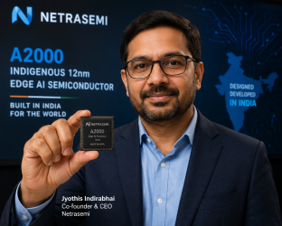 Netrasemi Co-founder and CEO Jyothis Indirabhai holding the newly launched A2000 indigenous 12nm edge AI semiconductor chip developed in India.